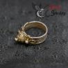 Ethnic silver ring side view – granulated knobs and floral wings visible