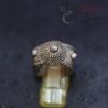Tribal silver ring displayed on stand showing domed crown and wire-textured band