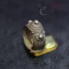 Golden Triangle tribal ring on stand with decorative knobs and traditional detailing