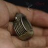 Lahu-Wa ceremonial ring shown on hand, mid-20th century ornamentation