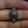 Ethnic silver ring worn on finger, showing proportion and tribal detailing
