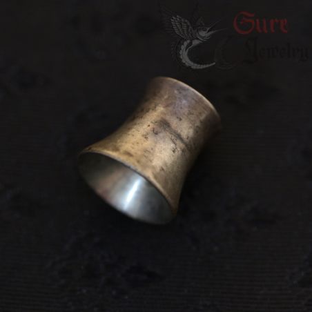 top side angle view of vintage burmese silver ear plug