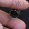 in hand close up showing opening of vintage burmese silver ear plug