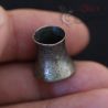 in hand view of patina on vintage burmese silver ear plug