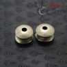 Side-angled top view of antique silver ear plug used by Yinbao Karen, showing front flare and aged surface."