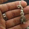 in hand side angle – lahu musur silver earrings held in hand side view