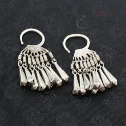 top side angle – lahu musur silver earrings top side view showing round bent shape and dangling filigree
