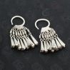 top side angle – lahu musur silver earrings top side view showing round bent shape and dangling filigree