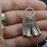 in hand side angle – lahu musur silver earrings held in hand side view showing size and patina