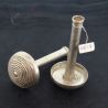 Pair of Pa-O silver ear plugs, angled from above