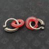 Antique Yao silver earrings with red glass circles – side angle top view