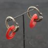 Antique Yao silver earrings with red glass circles – hanging display side perspective