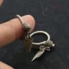 BACK SIDE ANGLE: Reverse view of antique Yao silver earrings with pendants IN HAND