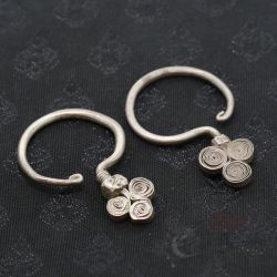 TOP SIDE ANGLE 1 – Antique Yao silver earrings spiral branch design top view