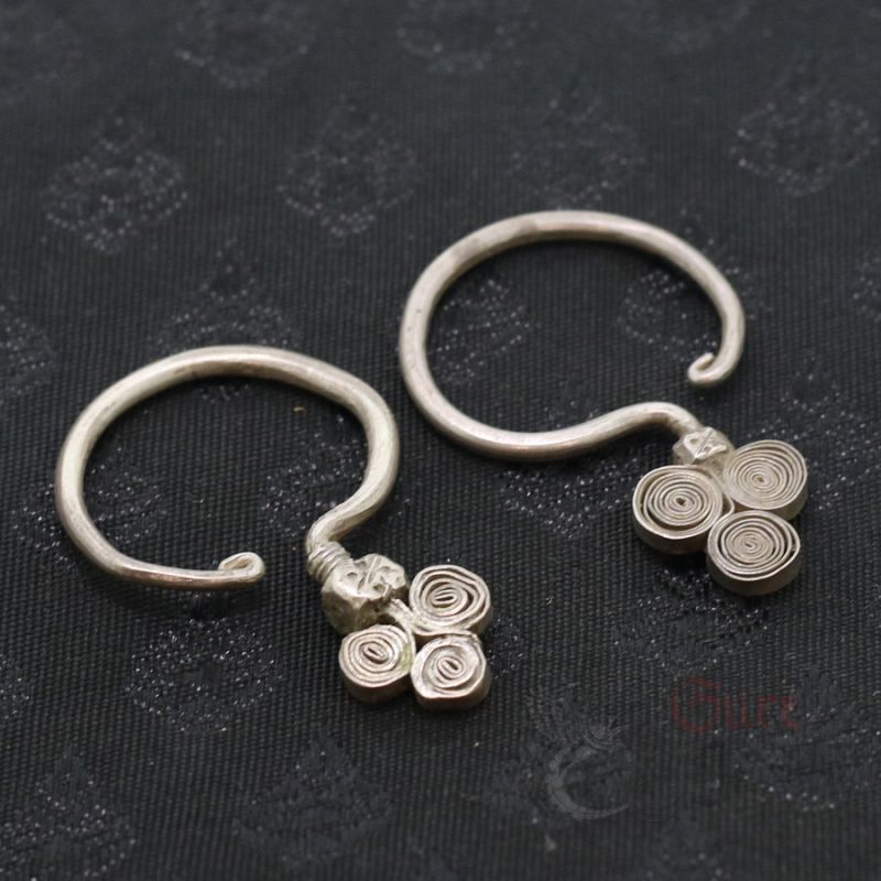 TOP SIDE ANGLE 1 – Antique Yao silver earrings spiral branch design top view