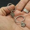 IN HAND SIDE ANGLE – Antique Yao silver earrings shown in hand for scale