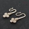 TOP ANGLE 2 – HAND-FORGED YAO TRIBAL SILVER EARRINGS LAID FLAT