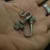 IN HAND SIDE ANGLE 1 – SIZE SCALE OF ANTIQUE SILVER YAO EARRINGS IN HAND