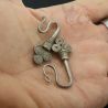 IN HAND SIDE ANGLE 2 – HAND-FORGED SPIRAL BRANCH SILVER EARRINGS FROM LAOS