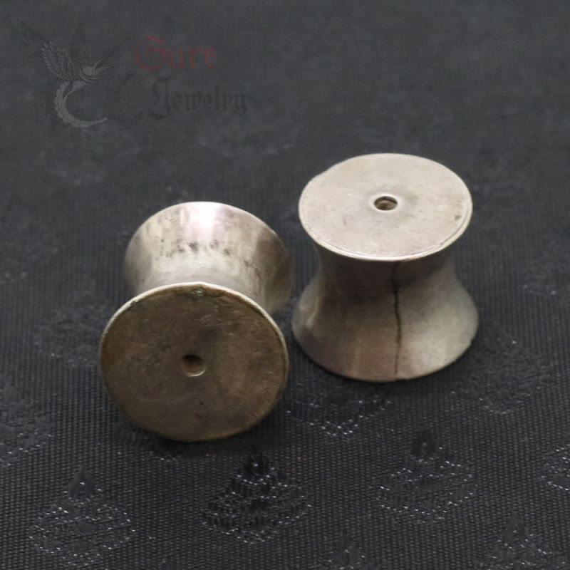 Top side angle – antique silver Palaung ear plugs, Shan States Burma, pair view 1