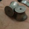 In hand side angle – antique Palaung ear plugs, scale reference, handmade silver 9