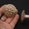 IN HAND SIDE ANGLE 1: ANTIQUE YAO SILVER PLUG EARRING IN HAND FOR SCALE