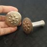 IN HAND SIDE ANGLE 2: TRIBAL YAO EAR PLUG SHOWING SIZE AND DETAIL