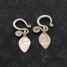 TOP ANGLE 2:
PAIR OF ANTIQUE YAO TRIBAL SILVER EARRINGS, TOP VIEW DISPLAYING LEAF PENDANTS AND HANDCRAFTED SILVER ALLOY SURFACE