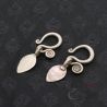 TOP ANGLE 4:
HANDMADE YAO SILVER EARRINGS, TOP VIEW OF LEAF-SHAPED PENDANTS WITH FAN AND GEOMETRIC MOTIFS