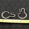 Antique Yao silver earrings placed next to ruler showing accurate measurements of 40mm by 25mm.