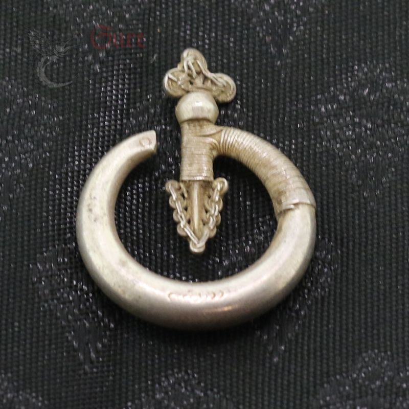 Top View 1 – Antique Yao silver earring top view showing bent arrow design and patina