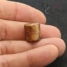 In Hand Side Angle 3: Authentic antique Thai Yai plug, side view, held in hand