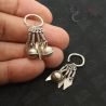 tribal silver yao earrings hand closeup