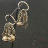 yao silver dangling bell earrings hanging display