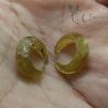 IN HAND SIDE ANGLE – RARE ANTIQUE KHMER GLASS EAR PLUGS SHOWING DETAIL