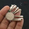 Antique hilltribe silver pendant held in hand side perspective