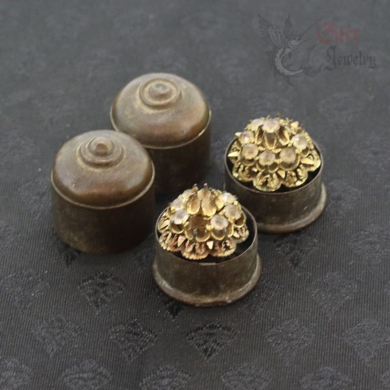 gilded bronze ear plugs arranged with copper box