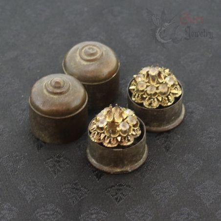 gilded bronze ear plugs arranged with copper box