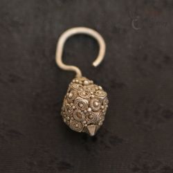 TOP SIDE ANGLE 1: ANTIQUE PADAUNG SILVER SEED BAG HOOK EARRING FROM BURMA