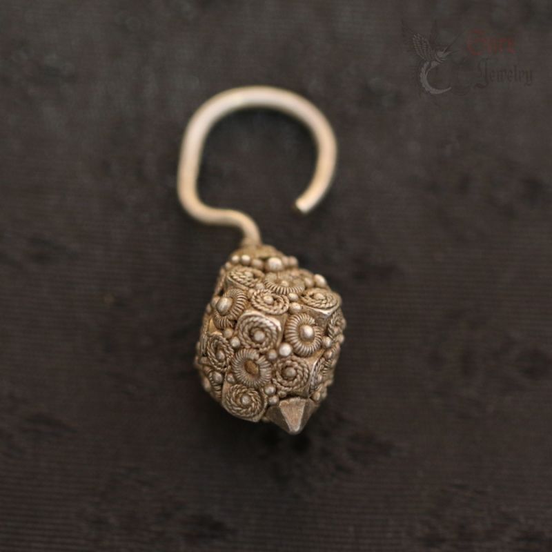 TOP SIDE ANGLE 1: ANTIQUE PADAUNG SILVER SEED BAG HOOK EARRING FROM BURMA