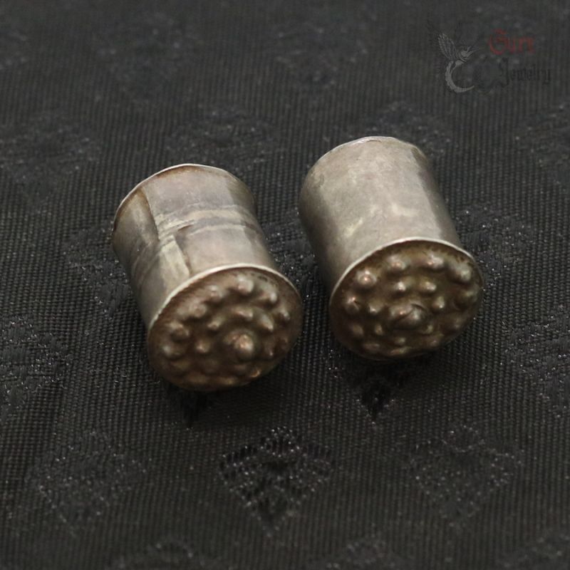 Traditional silver ear plugs from Myanmar, Mon Karen tribal jewelry, top side view