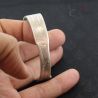 Lahu silver bangle held in hand showing thickness weight and craftsmanship