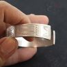 Musur silver bangle in hand side angle demonstrating scale and wearability
