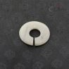 Ancient style jade like stone ear ornament slit ring top view on dark textile