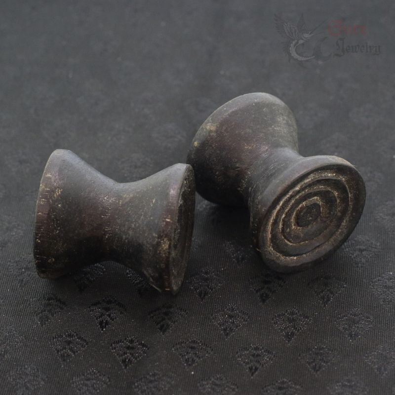 Antique Dayak ironwood ear plugs pair Borneo tribal jewelry top side angle 1