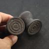 Antique Dayak ironwood ear plugs shown in hand side angle 1