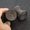 Antique Dayak ironwood ear plugs shown in hand side angle 3
