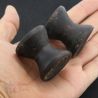 Antique Dayak ironwood ear plugs shown in hand side angle 5