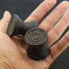 Antique Dayak ironwood ear plugs shown in hand side angle 6