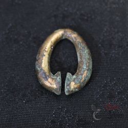 Antique Khmer omega earring in gilded bronze, top and side angle view showing aged patina and traces of gold gilding